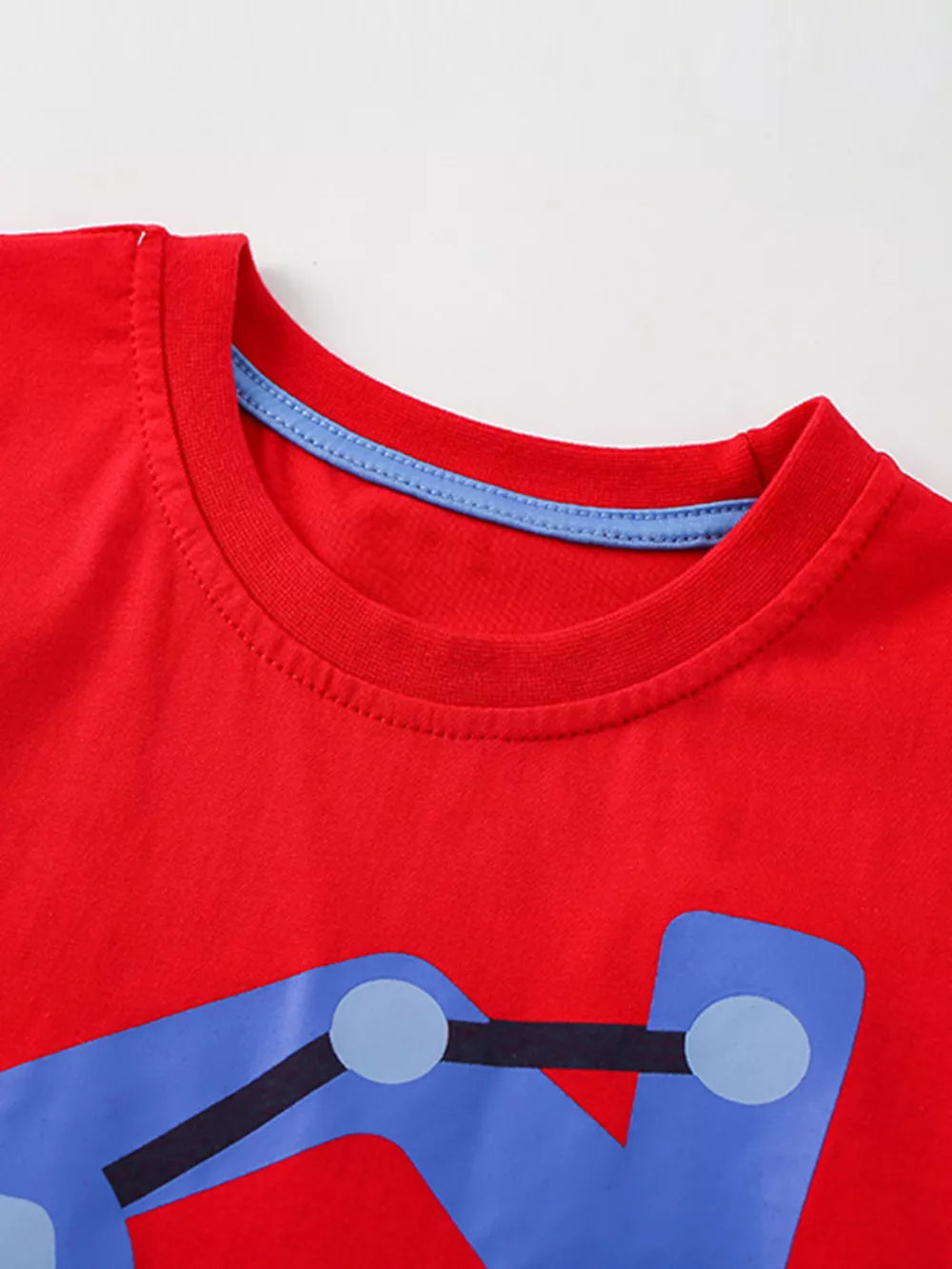 Red cotton toddler t-shirt with blue excavator graphic and blue trim neckline.