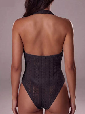 Black lace halter bodysuit with a high-cut leg and intricate patterned detail.