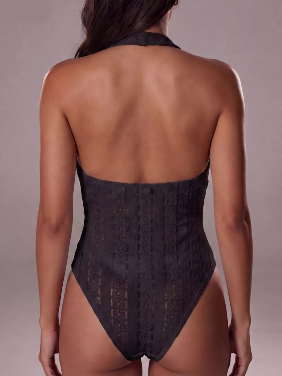 Black lace halter bodysuit with a high-cut leg and intricate patterned detail.