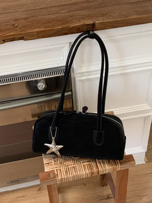 Black shoulder bag with star charm and double straps