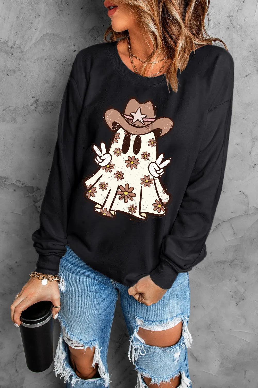 Black crewneck sweatshirt with a cowboy ghost graphic wearing a hat and holding peace signs.
