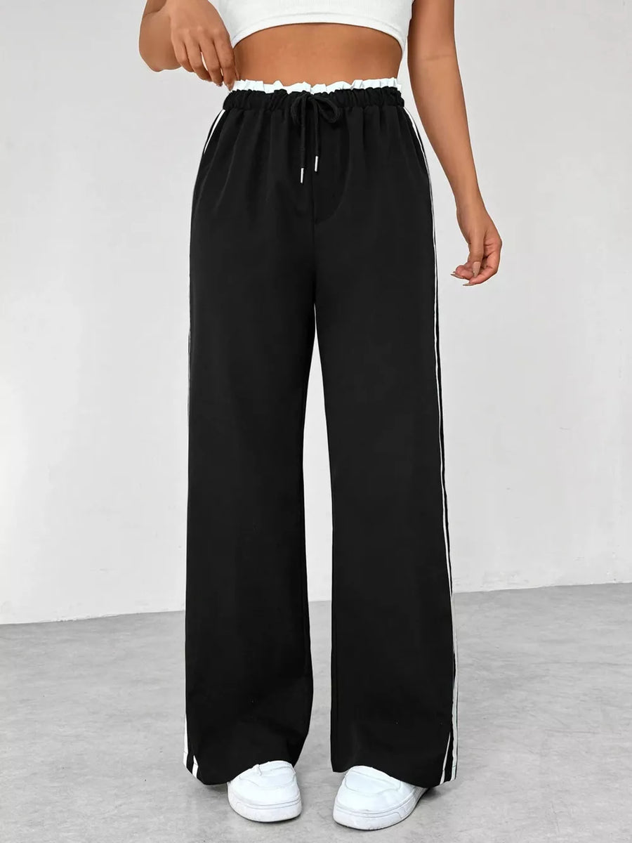 Chic black wide leg maternity pants with drawstring and white side stripes.