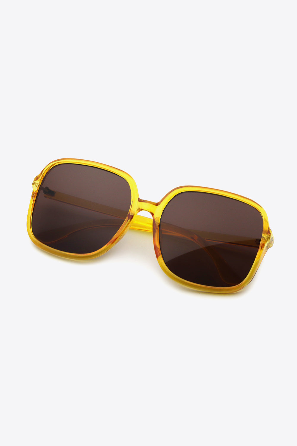 Yellow square frame sunglasses with dark lenses and a subtle tortoiseshell pattern on the arms.