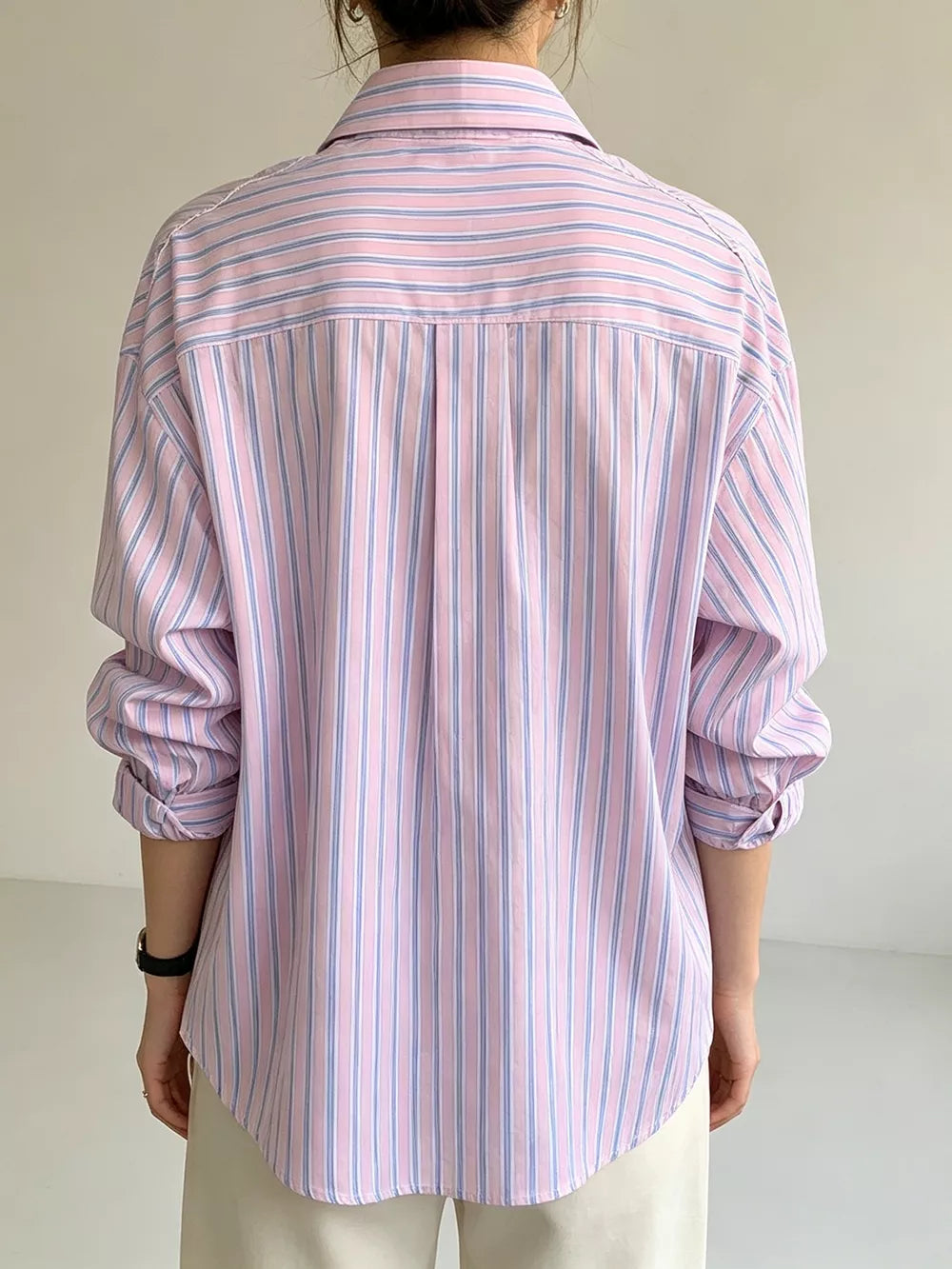 Blue button-down shirt with button-front and striped
