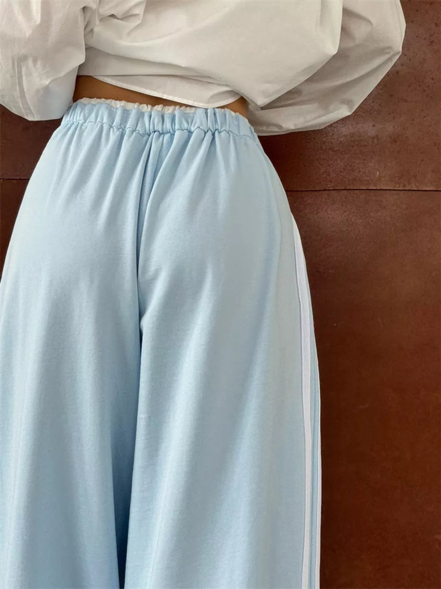 Yellow sweatpants featuring drawstring and striped