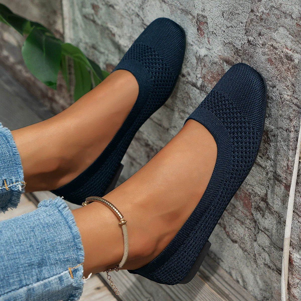 Dark blue breathable knit square-toe flats with a low heel.