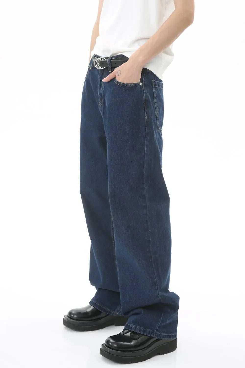 Baggy dark wash denim jeans with a subtle flare and a casual fit.