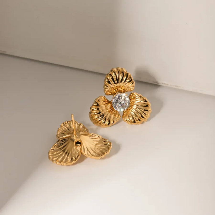 Gold petal stud earrings with crystal center detail