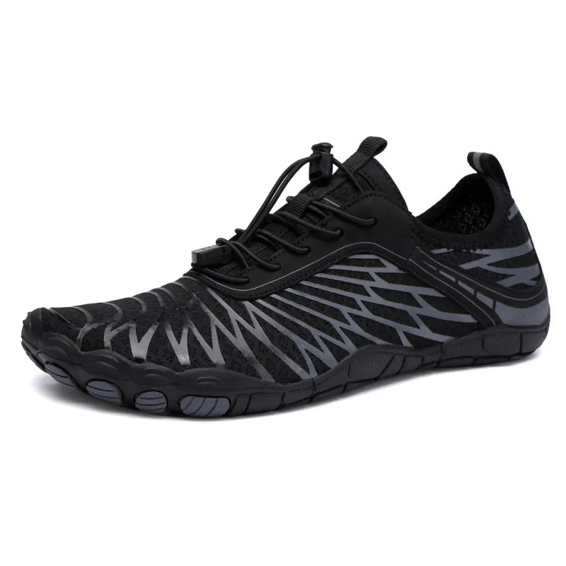Black adaptive mesh trail runners with grey zigzag pattern and quick-lace closure.