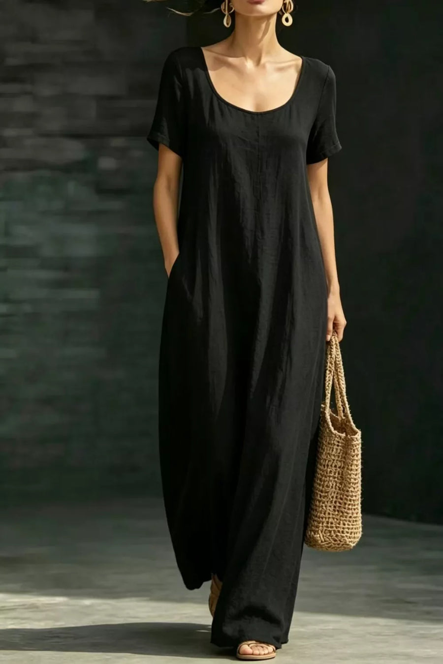 Black polyester maxi dress with short sleeves, scoop neck, and pockets.