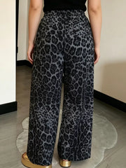 black wide-leg pants featuring drawstring waist and leopard-print