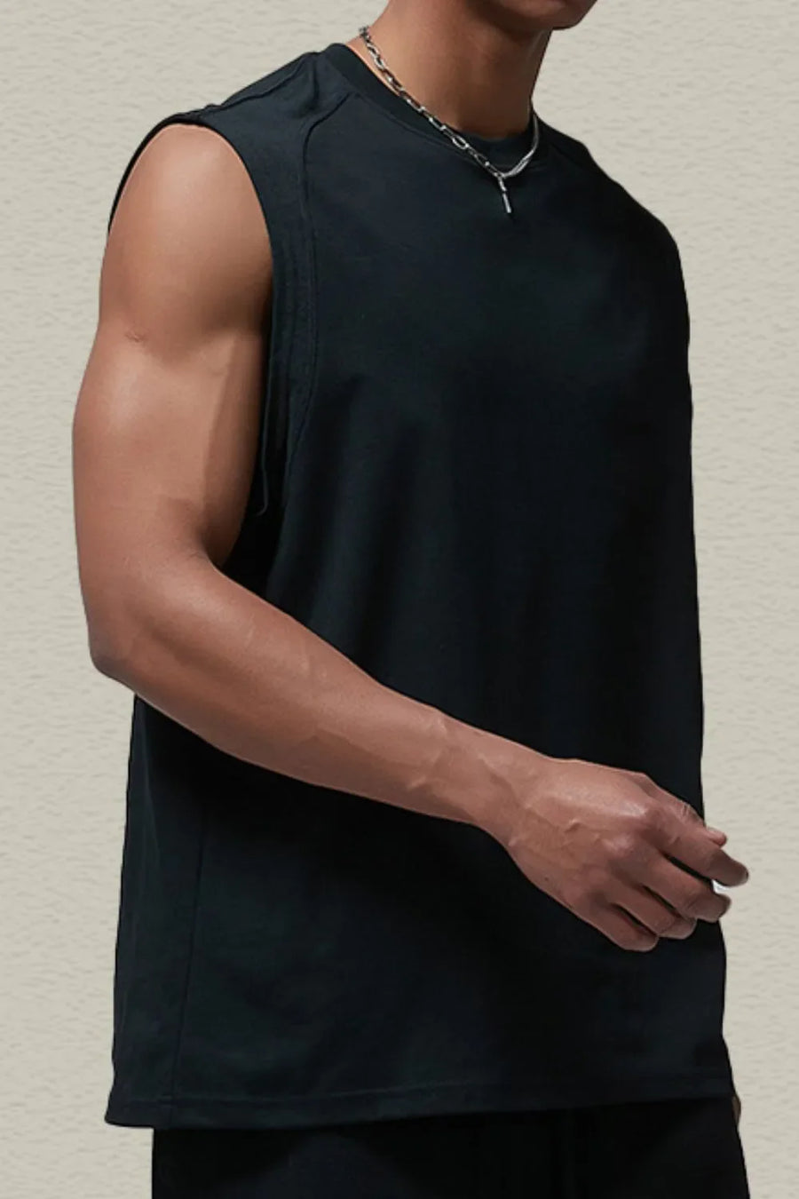 Black sleeveless shoulder-seam tank top with a crew neck.