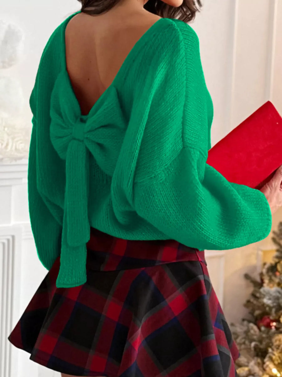 Green long-sleeve sweater with a large bow detail on the back.