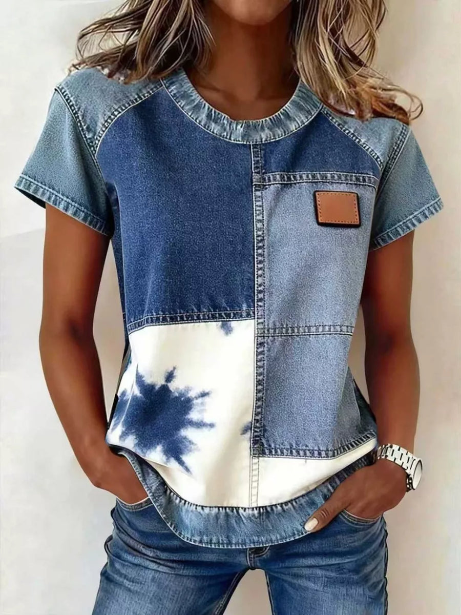 Denim patchwork short sleeve shirt with tie-dye detail and faux leather patch.