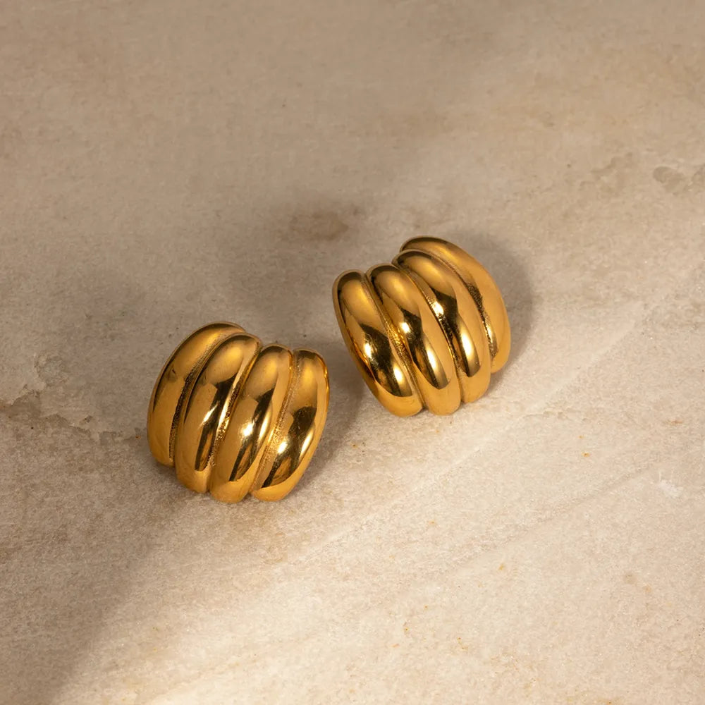 Sculptural ribbed gold earrings with 18K gold plating.