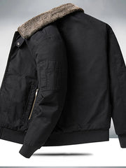 Black bomber jacket with plush sherpa collar, zip pocket and ribbed cuffs.