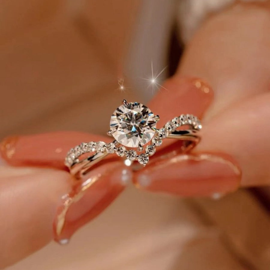 Sterling silver ring with round moissanite and accent stones, 1ct.