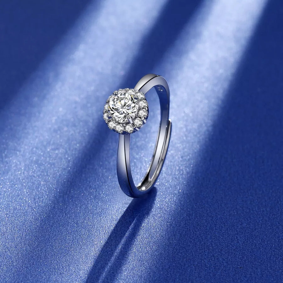 925 sterling silver,Moissanite Carat weight: 1ct Care instructions: Avoid wearin ring in clear with round halo silhouette