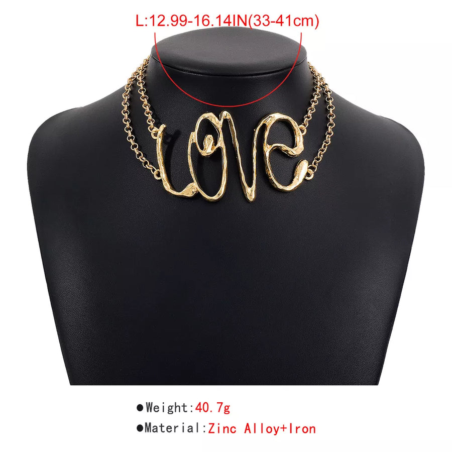 necklace in Gold with script and statement piece