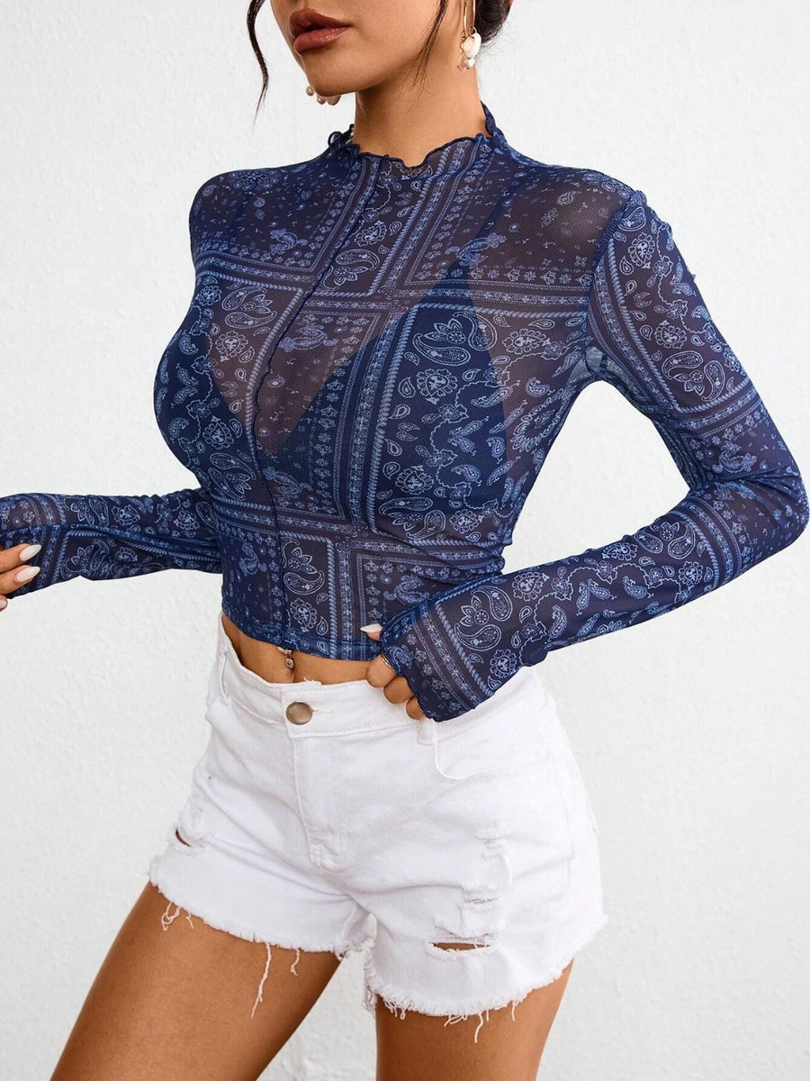 Dark blue bandana print mesh mock neck long sleeve top with lettuce trim.