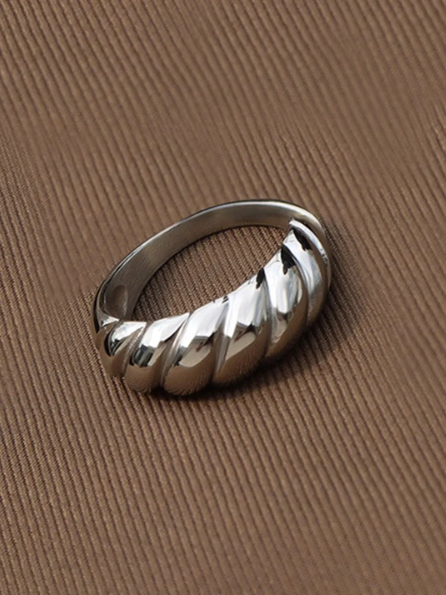Silver sculpted steel croissant ring with twisted band detail