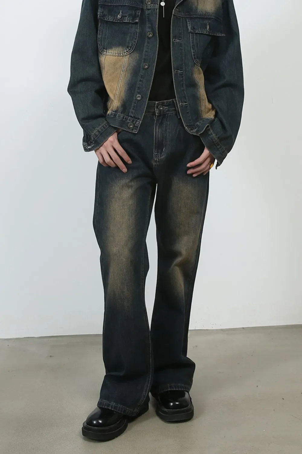 Dark faded denim flare jeans with a vintage wash and baggy fit.