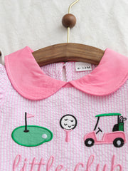 Pink seersucker baby dress with golf embroidery and a Peter Pan collar.