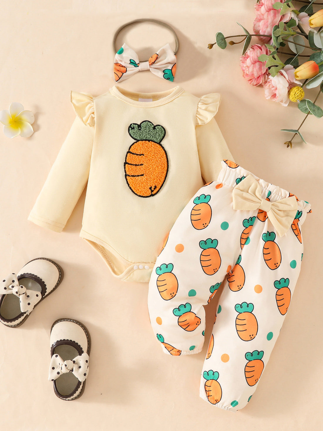 Baby girl yellow long sleeve bodysuit with carrot appliqué and matching carrot print pants with bow.