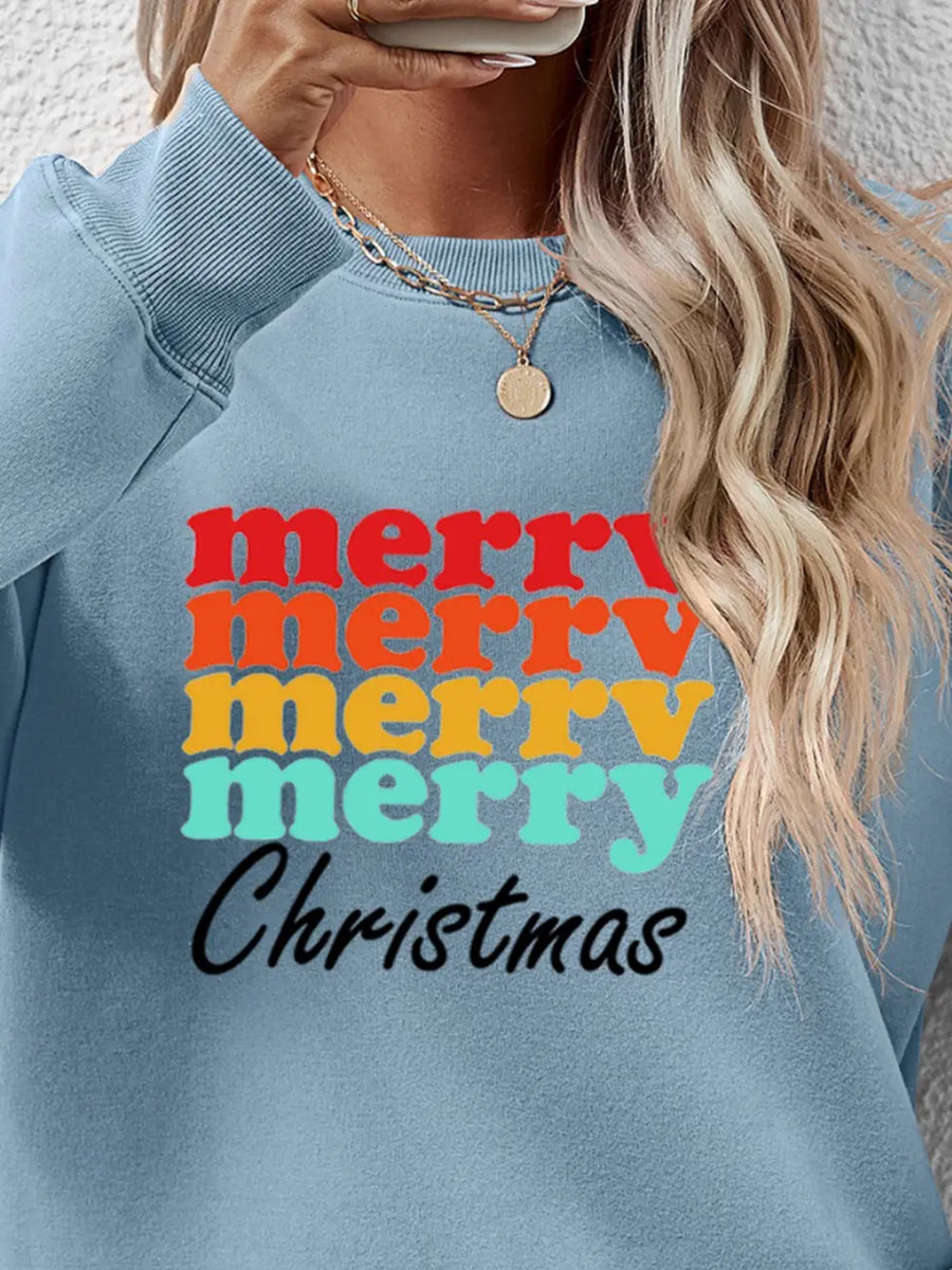 Light blue crewneck sweatshirt with retro "Merry Christmas" graphic in red, orange, yellow, and teal.