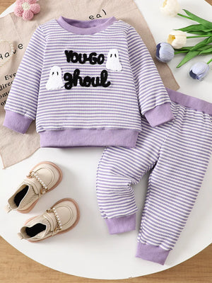 white pajama set featuring chenille patch and striped