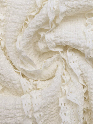 Cream textured maternity t-shirt with ruched detail and puff sleeves.