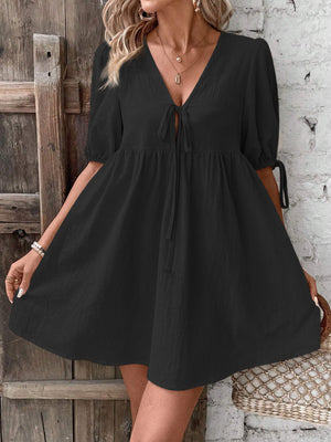Black tie front puff sleeve mini dress with a-line cut and v-neckline