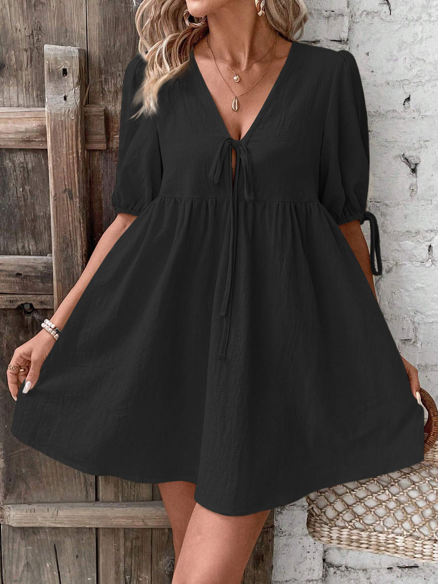 Black tie front puff sleeve mini dress with a-line cut and v-neckline