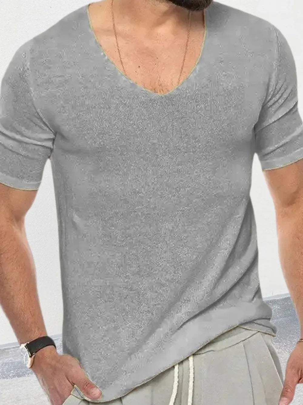 Gray textured knit V-neck tee with short sleeves and a subtle ribbed texture.