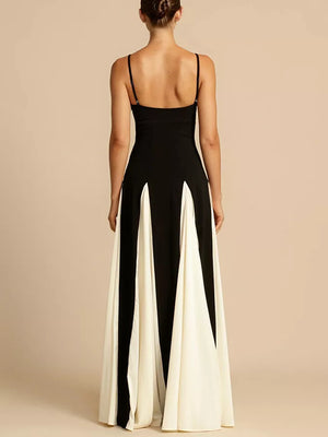 Elegant maxi dress with spaghetti straps in black and white with a flowing skirt.