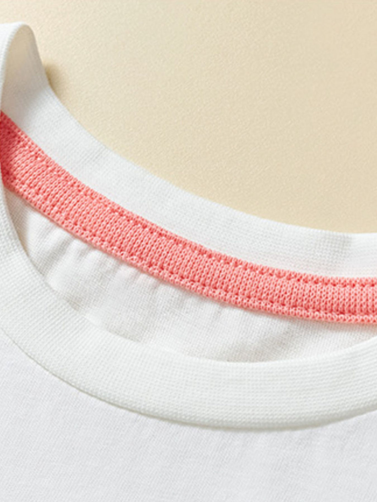 White cotton toddler t-shirt with pink ribbed crew neck detail