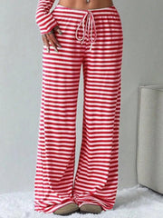 Red and white striped crop top and wide-leg pants with drawstring waist.