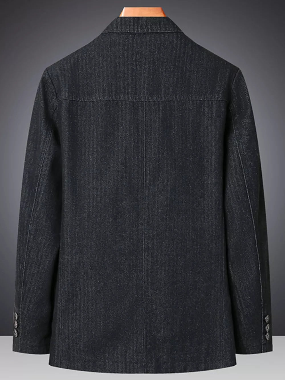 Textured dark blue denim blazer with notched lapels and buttoned cuffs.