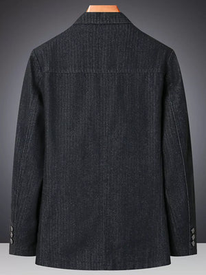 Textured dark blue denim blazer with notched lapels and buttoned cuffs.