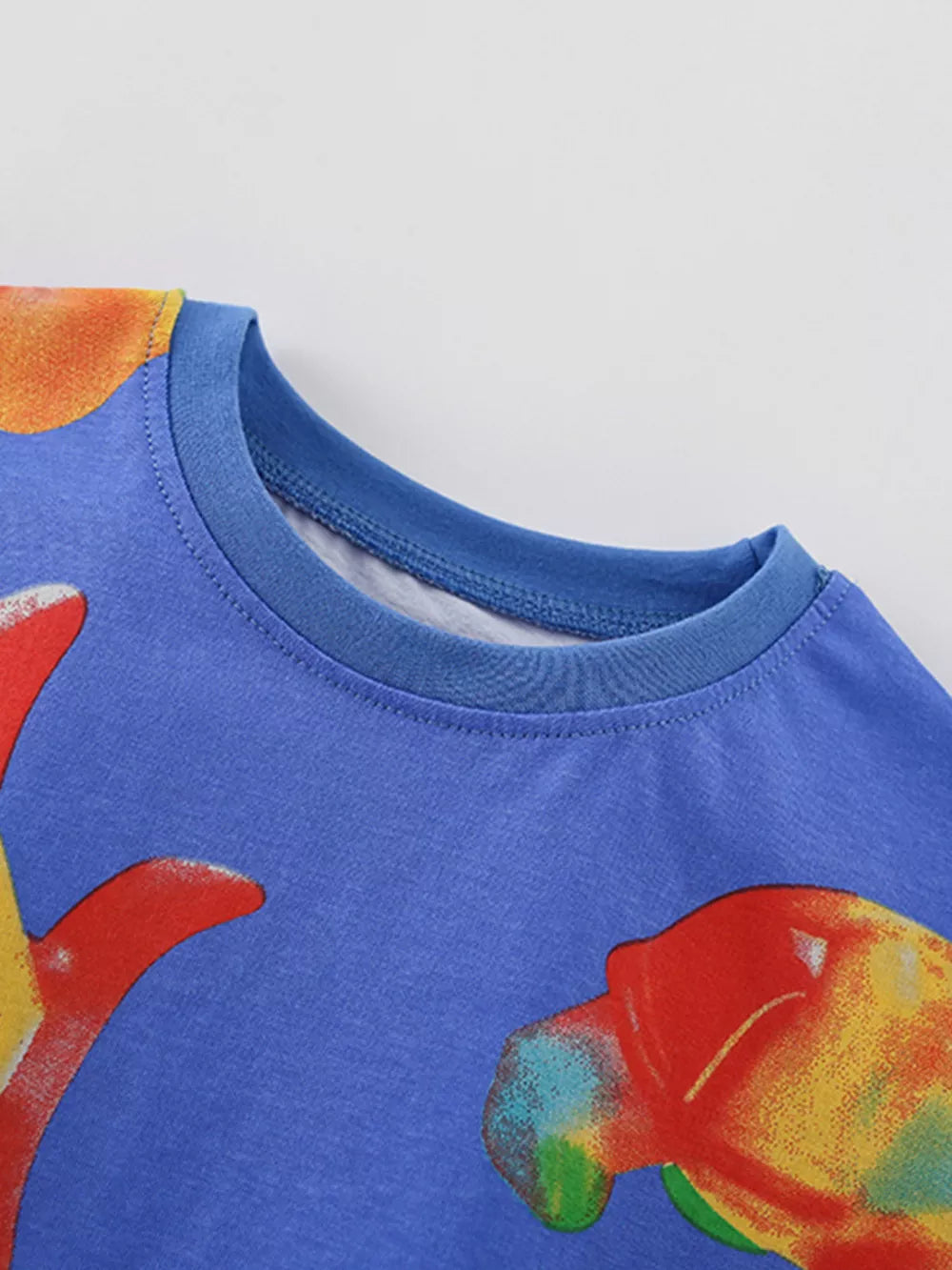 Blue cotton blend toddler crew neck tee with whimsical ocean creature print.