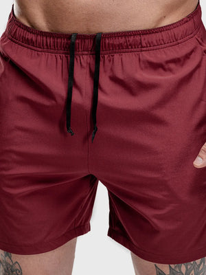 Burgundy performance shorts with drawstring and split hem