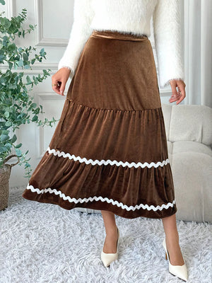 Tiered brown velvet midi skirt with white ric rac trim detail.