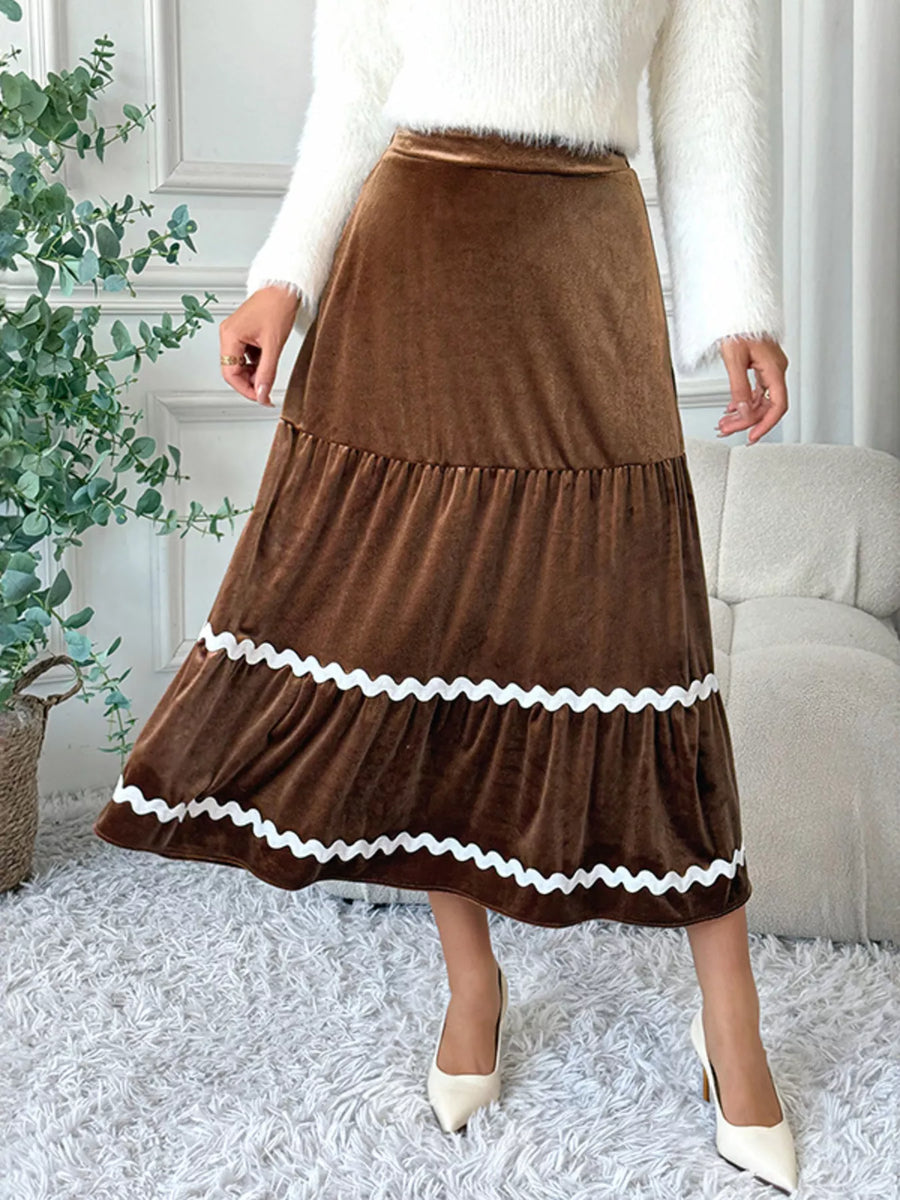 Tiered brown velvet midi skirt with white ric rac trim detail.