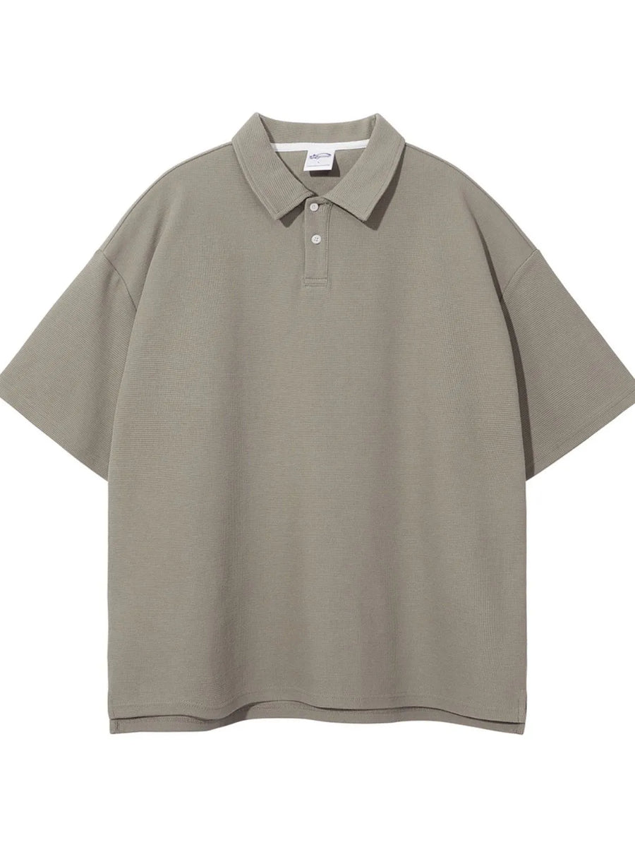 Boxy textured polo shirt in Khaki with short sleeves and a two-button placket.