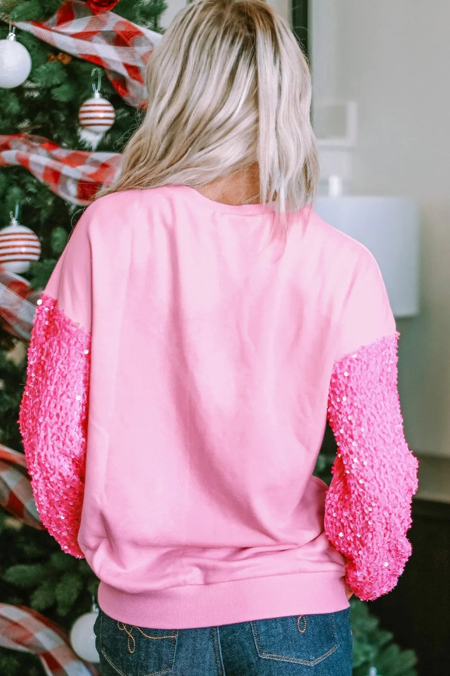 Pink sweatshirt with sequin sleeves and "Love" appliqué detail