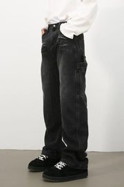 Carpenter jeans in washed black denim with a relaxed fit and utility pockets.