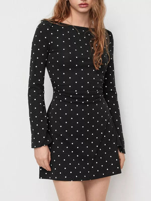 Red mini dress featuring ruched and polka dot