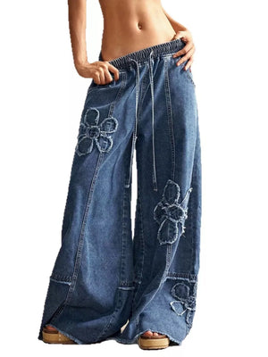Wide leg denim jeans with flower appliques and drawstring waist