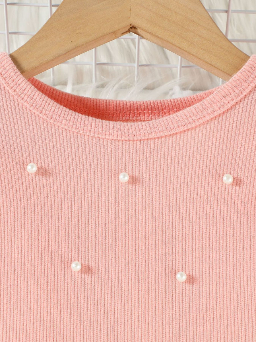 Pink ribbed baby top with pearl embellishments