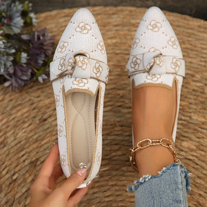 White knitted pointed flats with gold bow detail and floral pattern
